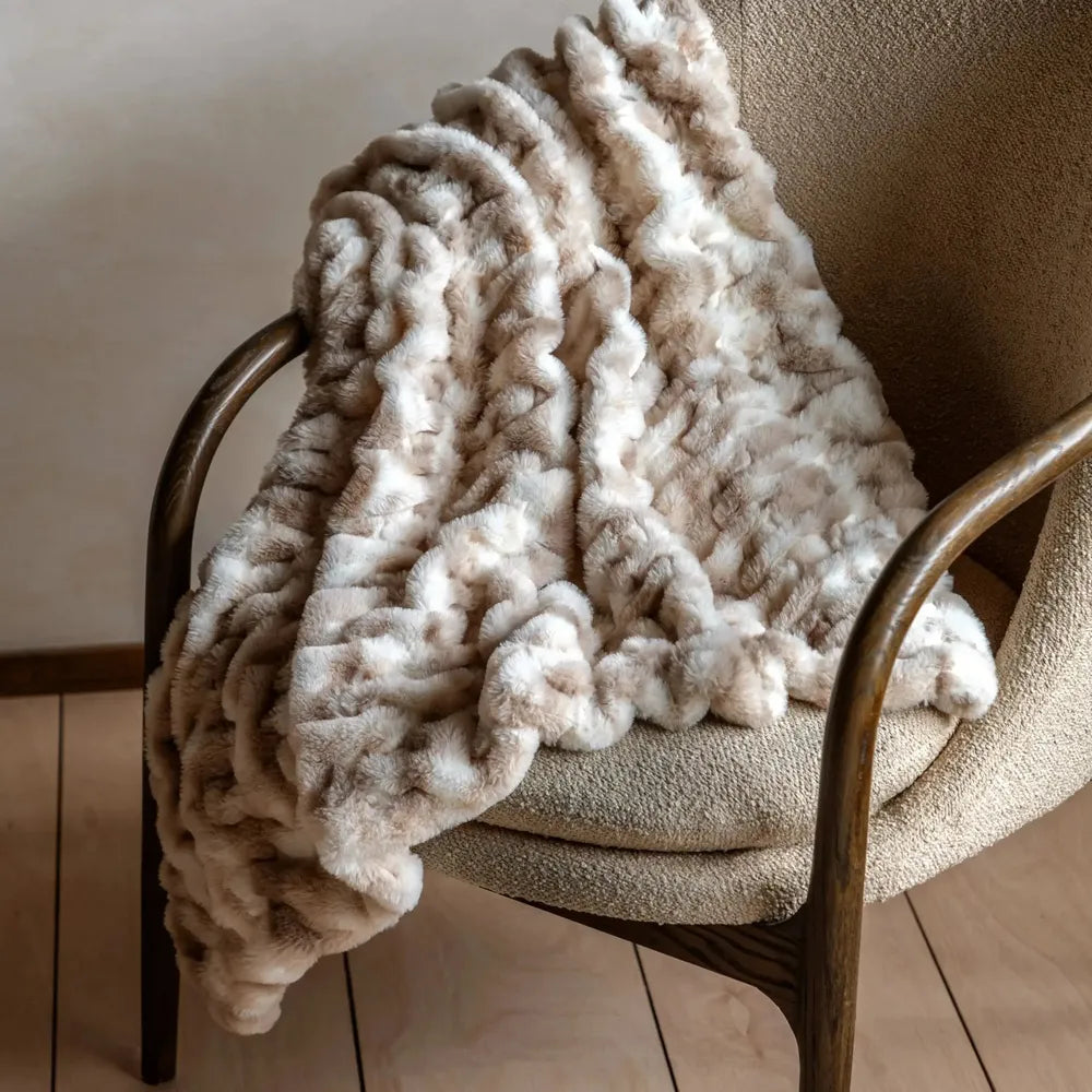 Deco Luxe Ruched Faux Fur Throw — product and styling photograph